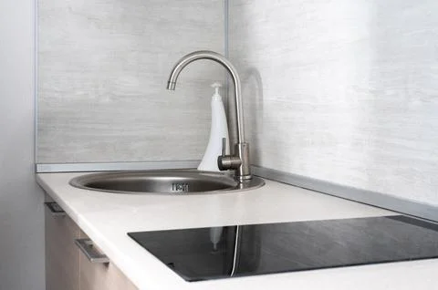 Little white kitchen clean interior design background. economical kitchen wit Stock Photos