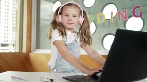 Little young cute girl using laptop to working or playing games. Erudition. Stock Footage 277380902