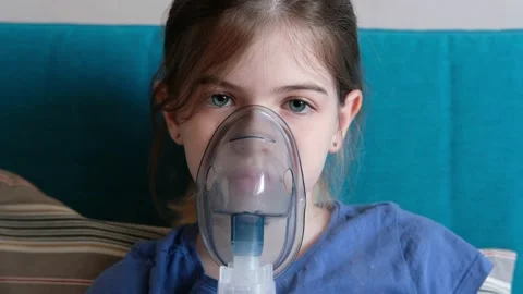 A little / young sick girl does inhalati... | Stock Video | Pond5