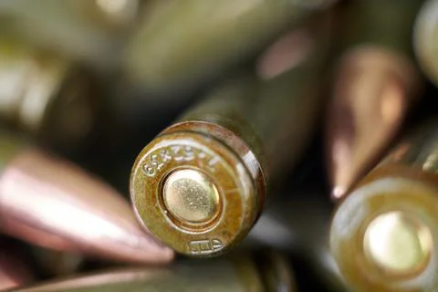 Live ammunition for automatic weapons or rifles ranked. Close-up view. Stock Photos