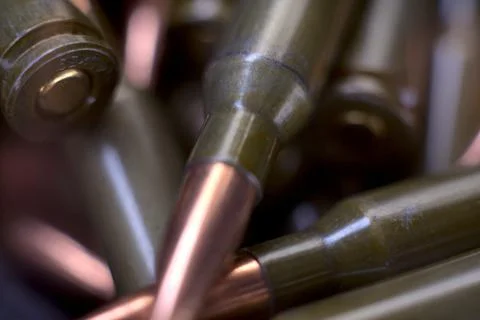 Live ammunition for automatic weapons or rifles ranked. Close-up view. Stock Photos