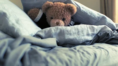 Live Animated Teddy Bear In Bed Pushing Up Against A Pillow Stock Footage 117242479
