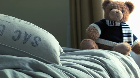 Live Animated Teddy Bear Sitting And Stretching On A Bed Vídeo Stock 117244402