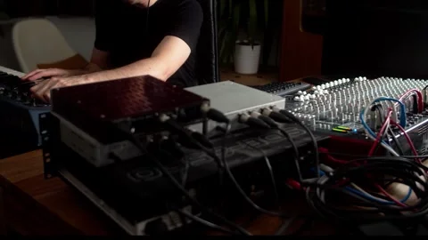 Live audio mix of musical performance on analogue mixer, synth and outboad gear Stock Footage 345096279