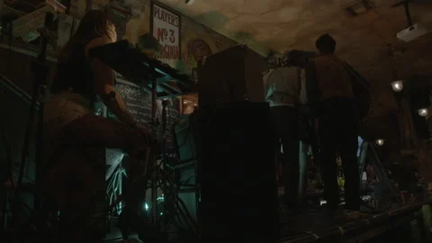 Live Band Performing on Stage in Dimly Lit Bar Stock Footage 343954584