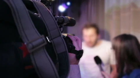 Live broadcasting, television operator with camera Stock Footage 50686760