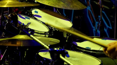 Live concert performance, a drummer energetically playing on the stage. Scene Stock-Footage 318048586