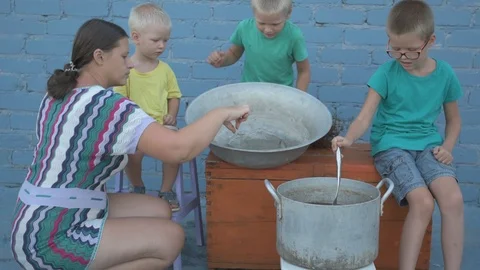Live crayfish caught in river are cooked in arge aluminum pan in open air. Wo Stock Footage 93293147