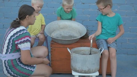 Live crayfish caught in river are cooked in arge aluminum pan in open air. Wo 動画素材 93293189