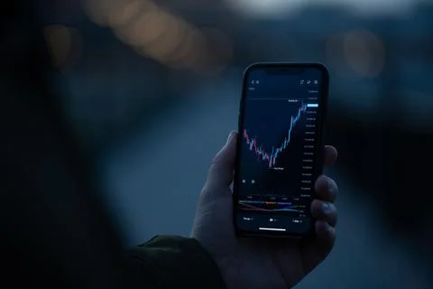 Live forex graph chart on smartphone screen Stock Photos