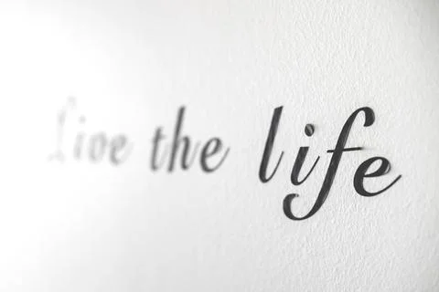 Live the life word phrase on a white wall Stock Photos
