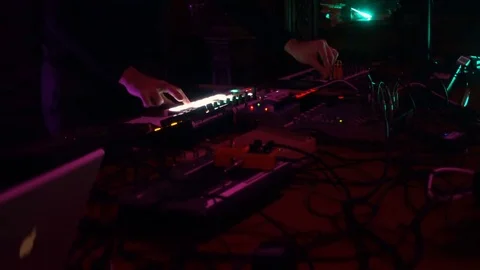 Live performance of an electronic DJ on the mixing console Stock Footage 70550301