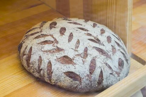 Live sourdough bread with a pattern of bran. Stock Photos