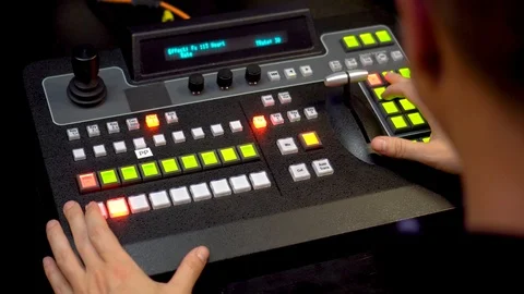 Live stream  broadcast from video switcher mixer with mens hands Stock Footage 121235418