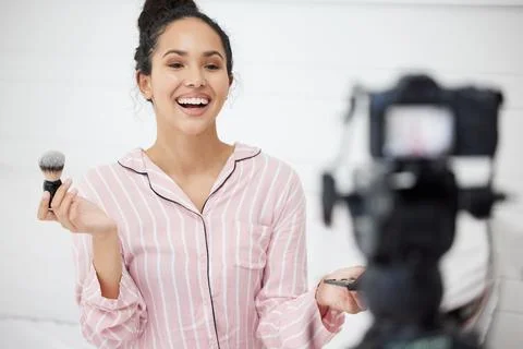 Live stream, makeup tutorial and influencer woman in living room of home as Stock Photos