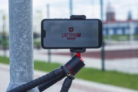 Live Strream and subscribe to Internet channel on the smartphone display on a Stock Photos