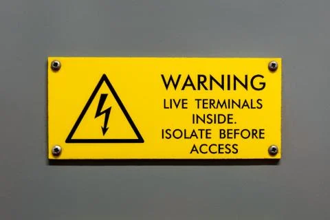 Live terminals inside isolate before access warning sign Stock Photos