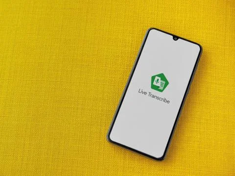 Live Transcribe app launch screen with logo on the display of a black mobile  Stock Photos