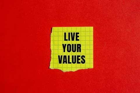 Live your values message written on ripped torn paper background. Conceptua.. Stockfoto's