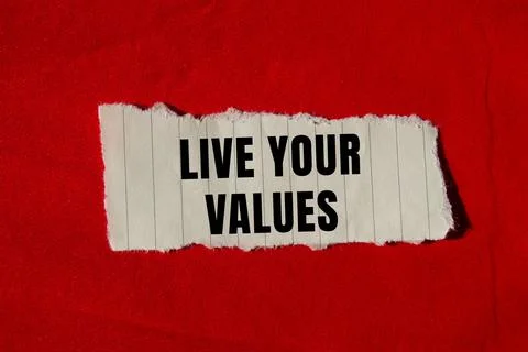 Live your values message written on ripped torn paper background. Conceptua.. Stockfoto's