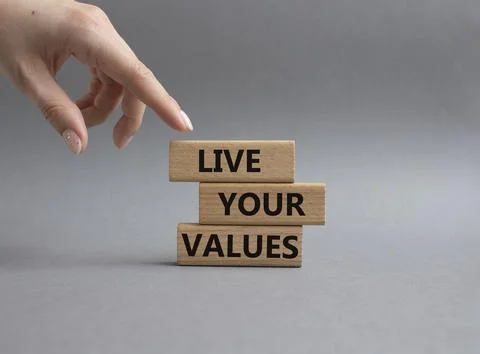 Live your values symbol. Concept words 'Live your values' on wooden blocks. B Stock Photos