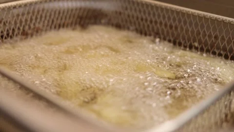 The lively atmosphere of a local kitchen as fresh ingredients are submerged in Stock Footage 304453622