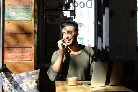 Lively conversation between two young people in cafe Foto stock