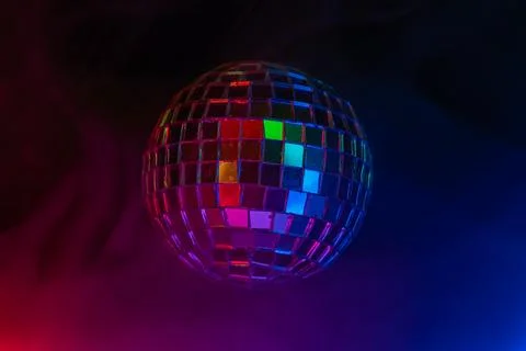 A lively disco scene with a central disco ball, vibrant lighting, and a dark  Stock Photos