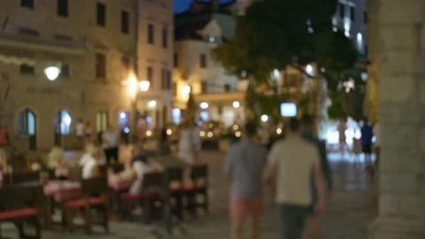 Lively evening square in a small old European town. Summer terraces of cafes and Stock-Footage 157486179