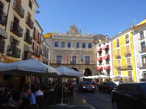 A lively historic square in Cuenca, centered around an impressive civic building Fotos Stock