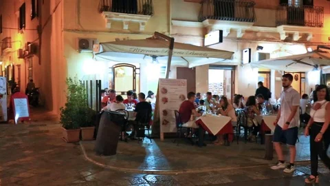 The lively nightlife in restaurants and bars in the alleys of the historic ce Stock Footage