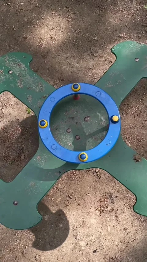 Lively park setting featuring play equipment basking in warm sunlight Видео 335355958