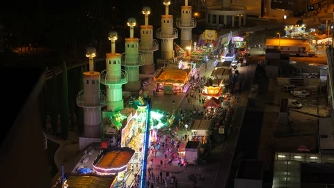 Lively temporary amusement park, time lapse shot at night, view from height Video stock 124094717