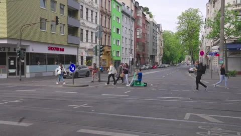 A lively urban intersection captured with cyclists riding Stock Footage 325099977
