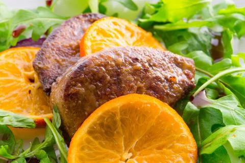 Liver with onion-orange sauce Stock Photos