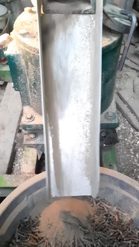 Livestock feed pellet machine processing ingredients, vertical video display Stock Footage 310463967