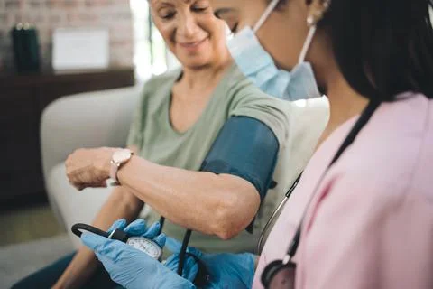 Living is a choice, so is making a difference. a masked doctor reading her Stock Photos