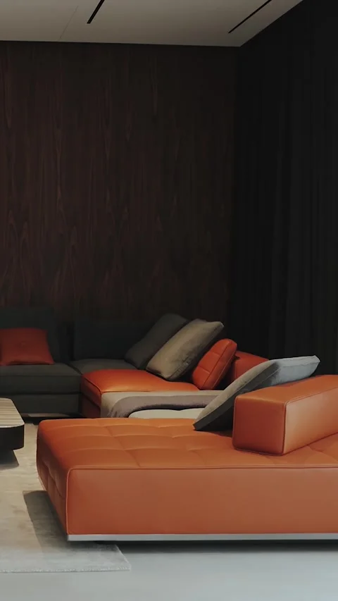 Living room with a chic orange sofa along with a set of stylish decor elements Stock Footage 311258535