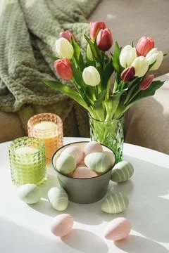 Living Room Decorated Easter Eggs , Candles and Tulips. Cozy Spring Holiday.. Stock Photos