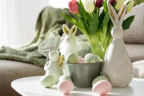 Living Room Decorated Easter Eggs with Bunny Figurines and Tulips. Cozy Spr.. Stock Photos