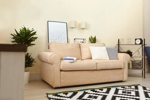 Living room interior with sofa and stylish decor elements Stock Photos