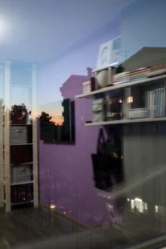 The living room is reflected in the window, double exposure Stock Photos