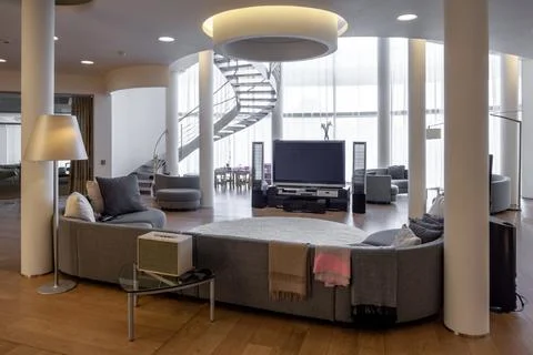 Living room with TV and home theater, upholstered lounge set and spiral Stock Photos