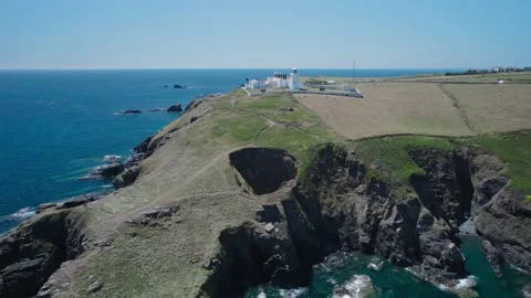 Lizard Lighthouse and Housel Bay Cliffs from a drone, Lizard, Helston, Cornwall 動画素材 201171985