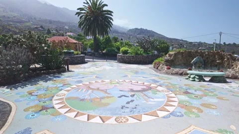 Lizard Mosaic Floor and Mountain Landscape View from Plaza La Glorieta Stock Footage 343507923