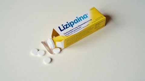 Lizipaina Medication Box With White Tablets Spilled On Light Textured Stock Footage 325418042