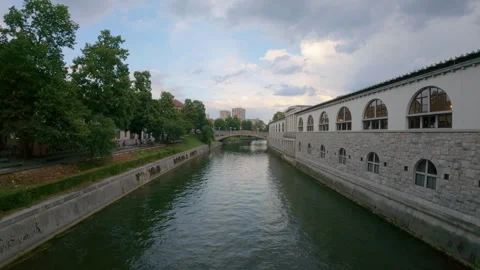 The Ljubljanica River flows past The Central Market building Stock Footage 346161568