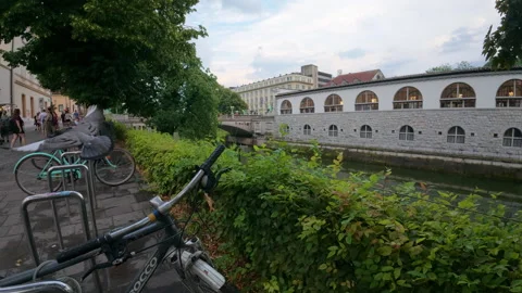 The Ljubljanica River flows past The Central Market building Stock Footage 346162267