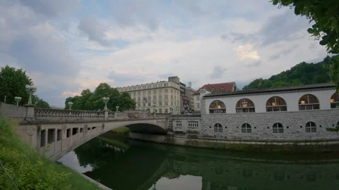 The Ljubljanica River flows past The Central Market building Stock Footage 346163149