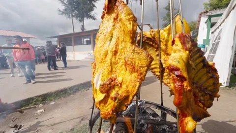 Llanera style beef ribs roasting on an open fire at a traditional fair Video stock 335700742